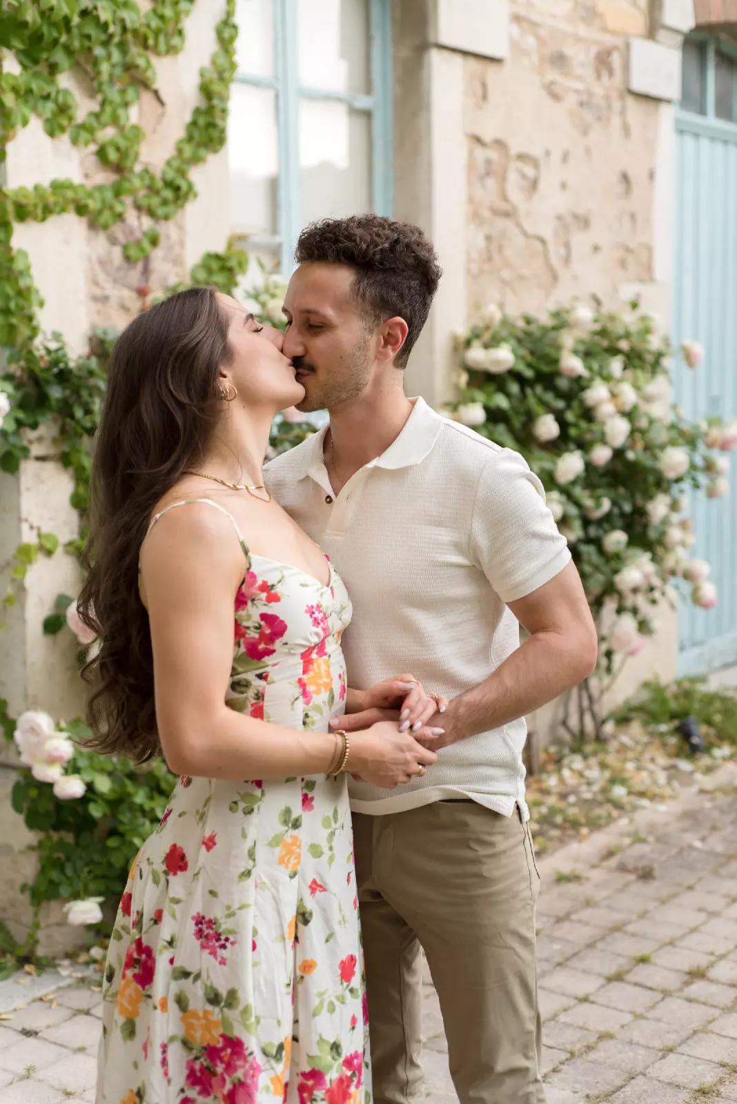 Newly engaged couple kissing